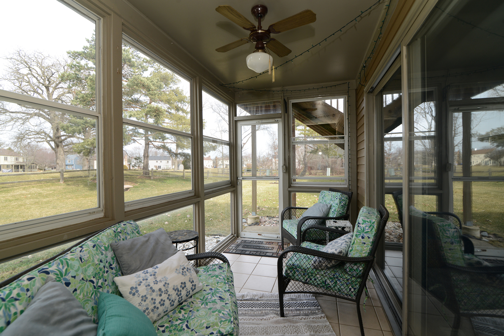 116 Dunham Place Commons, Unit 116 St. Charles, IL 60174 - Photo 11 of 26 a living room with furniture and floor to ceiling windows