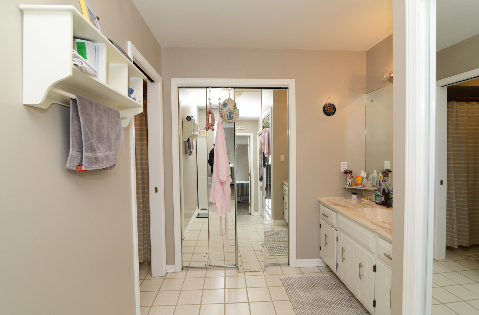 116 Dunham Place Commons, Unit 116 St. Charles, IL 60174 - Photo 12 of 26 a bathroom with a sink and a mirror