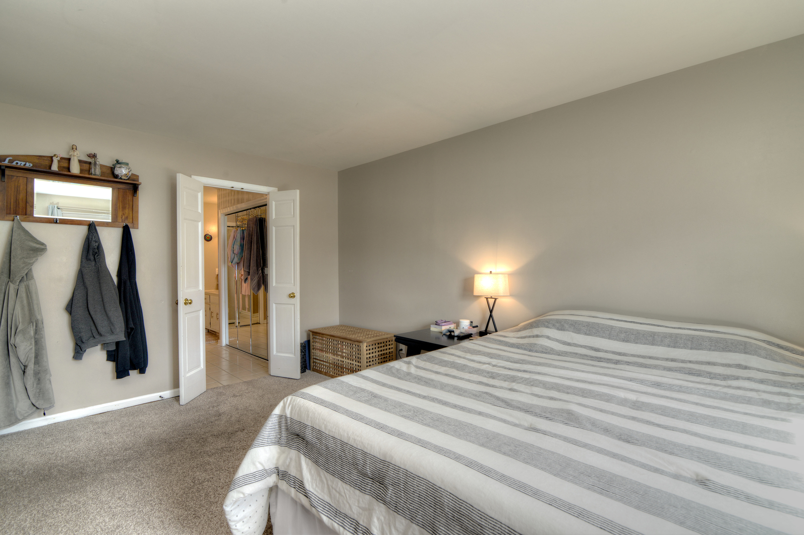 116 Dunham Place Commons, Unit 116 St. Charles, IL 60174 - Photo 15 of 26 a bedroom with a bed and a walk in closet