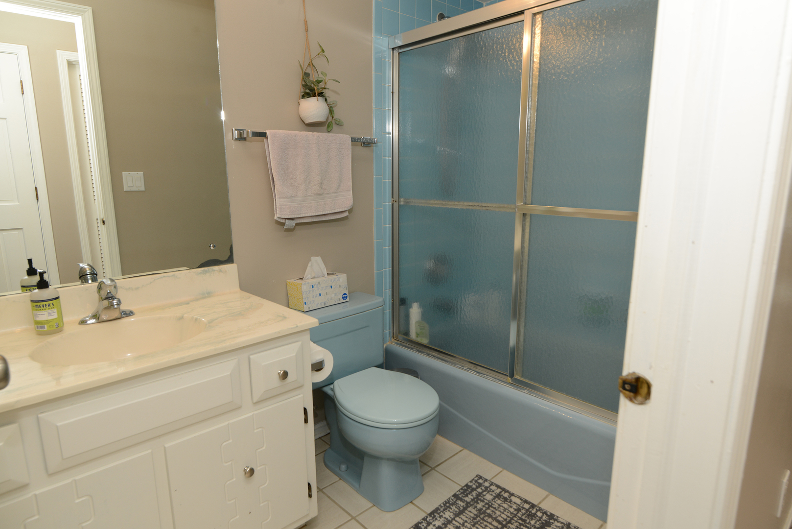 116 Dunham Place Commons, Unit 116 St. Charles, IL 60174 - Photo 16 of 26 a bathroom with a granite countertop sink toilet a mirror and shower