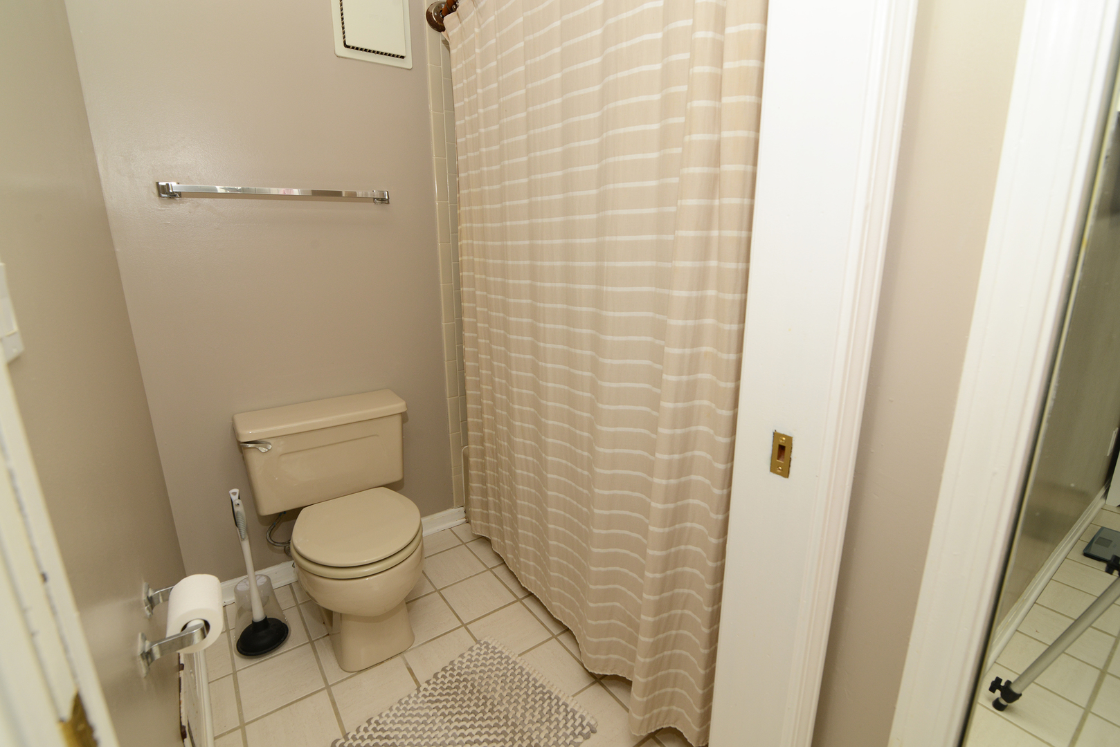116 Dunham Place Commons, Unit 116 St. Charles, IL 60174 - Photo 18 of 26 a white toilet sitting next to a shower curtain