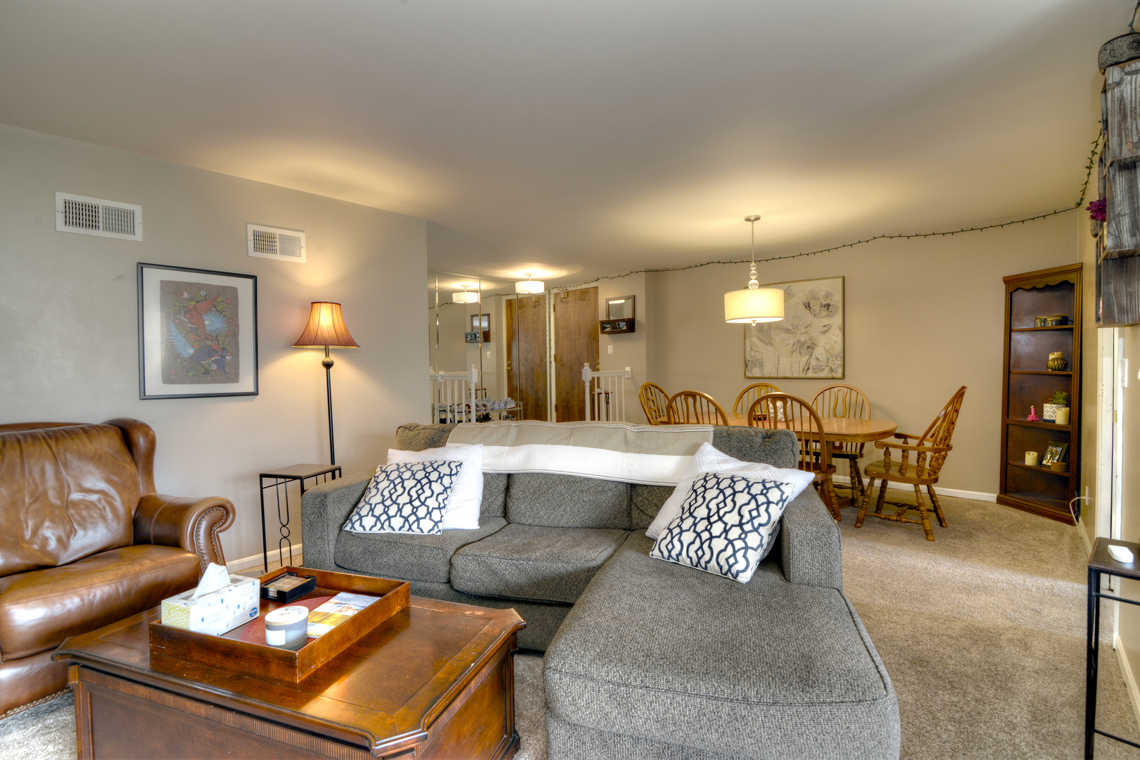 116 Dunham Place Commons, Unit 116 St. Charles, IL 60174 - Photo 2 of 26 a living room with furniture and view of kitchen