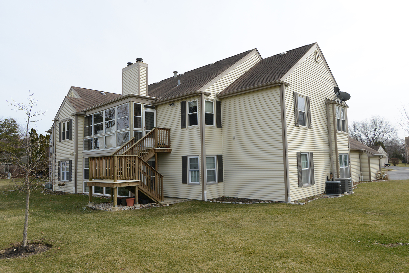 116 Dunham Place Commons, Unit 116 St. Charles, IL 60174 - Photo 23 of 26 a view of a house with a yard