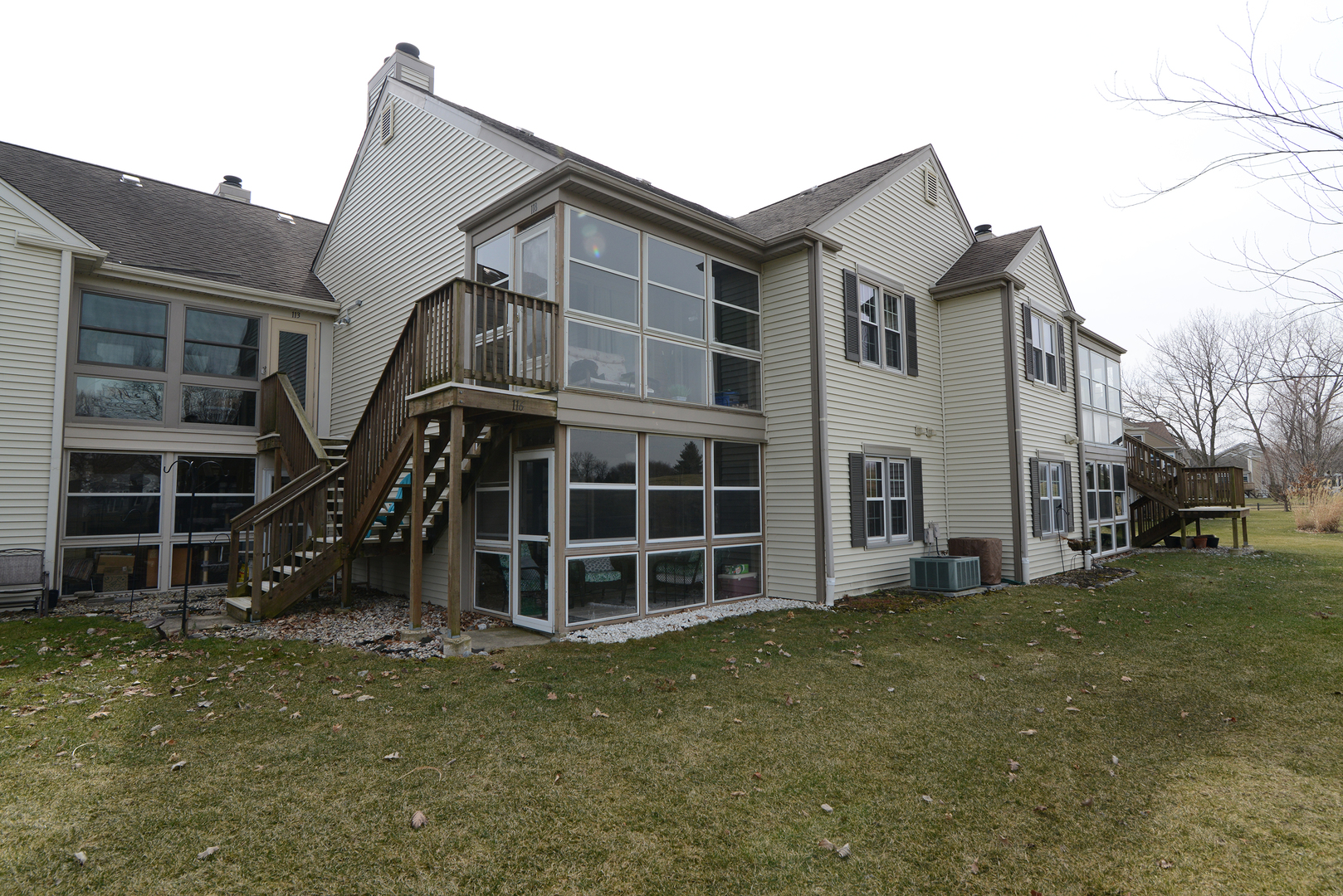 116 Dunham Place Commons, Unit 116 St. Charles, IL 60174 - Photo 24 of 26 a front view of a house with a yard