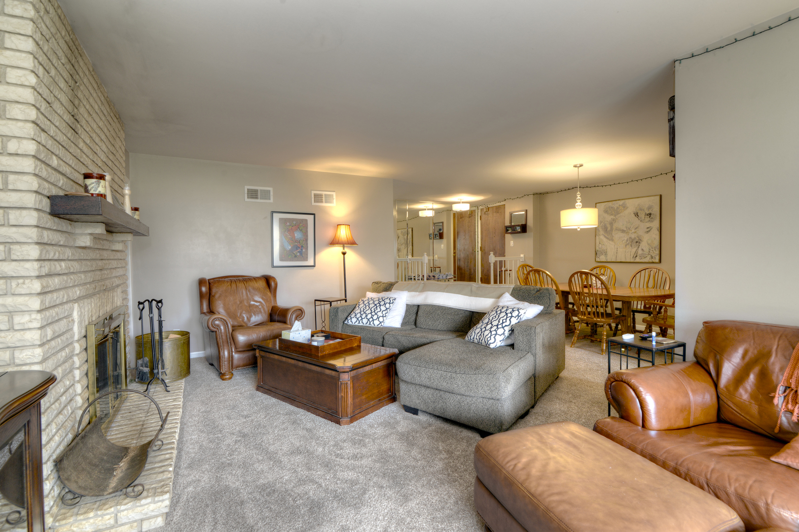 116 Dunham Place Commons, Unit 116 St. Charles, IL 60174 - Photo 3 of 26 a living room with furniture and a fireplace