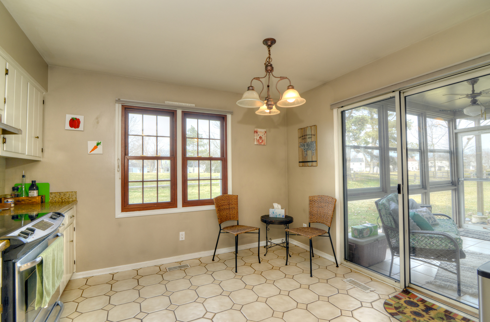 116 Dunham Place Commons, Unit 116 St. Charles, IL 60174 - Photo 8 of 26 a view of a dining room with furniture wooden floor and chandelier