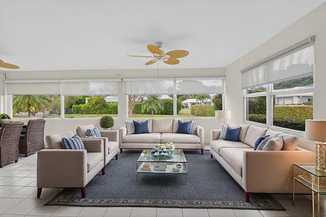 a view of a dining room with furniture and window