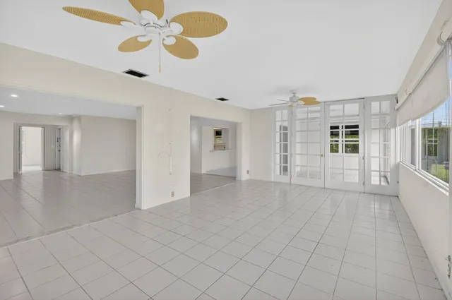 a kitchen with white cabinets stainless steel appliances and sink