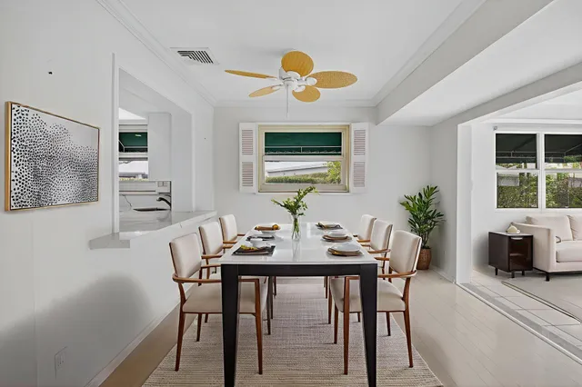 a view of a kitchen with white cabinets