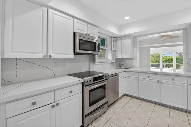 a view of a patio with a yard