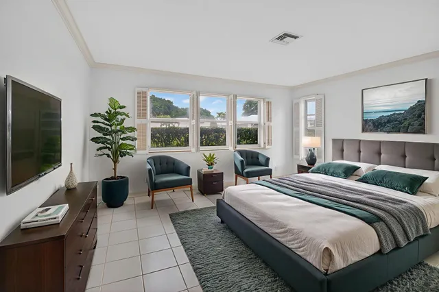 an aerial view of residential houses with outdoor space and parking