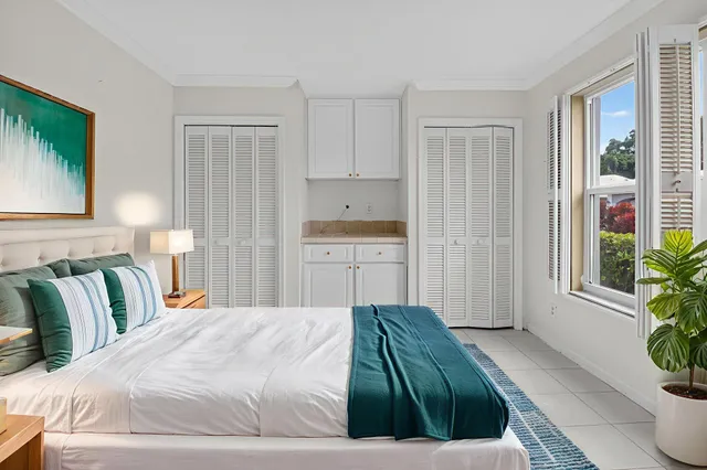 an aerial view of a house with swimming pool garden and patio