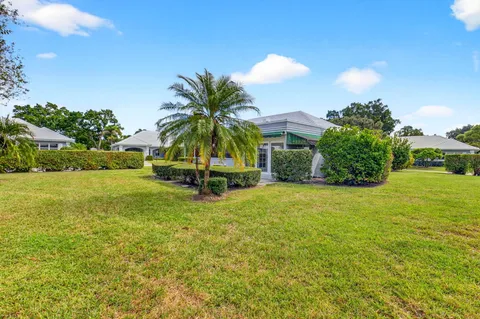 a view of a patio with couches chairs and a fire pit