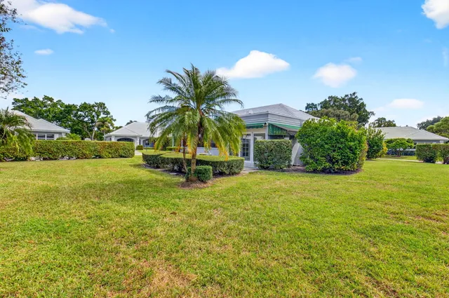 a view of a patio with couches chairs and a fire pit