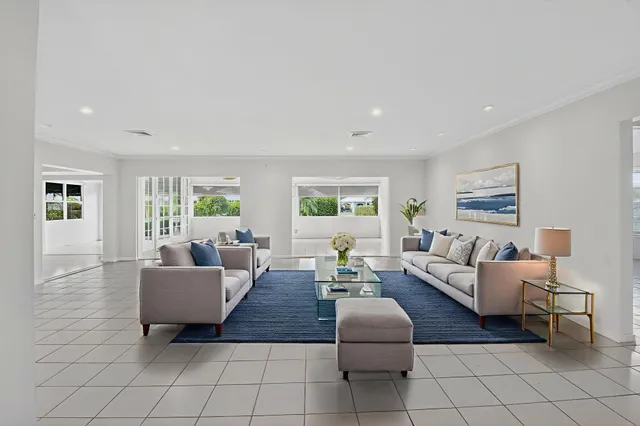 an empty room with windows and entrance