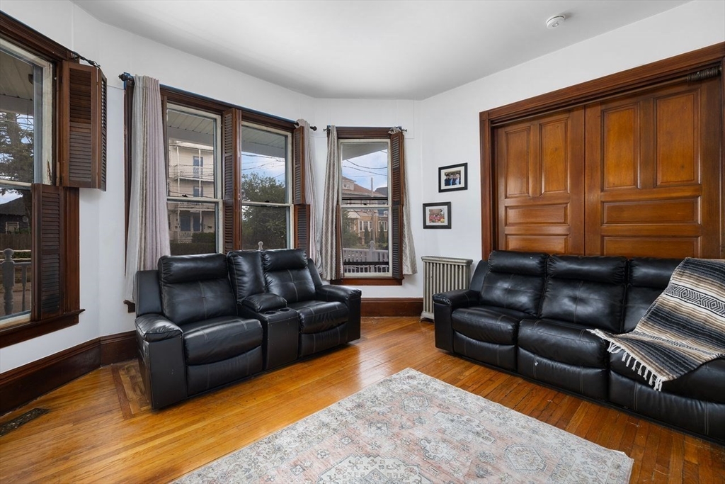 311 Elm Street Woonsocket, RI 02895 - Photo 9 of 29 a living room with furniture and a large window