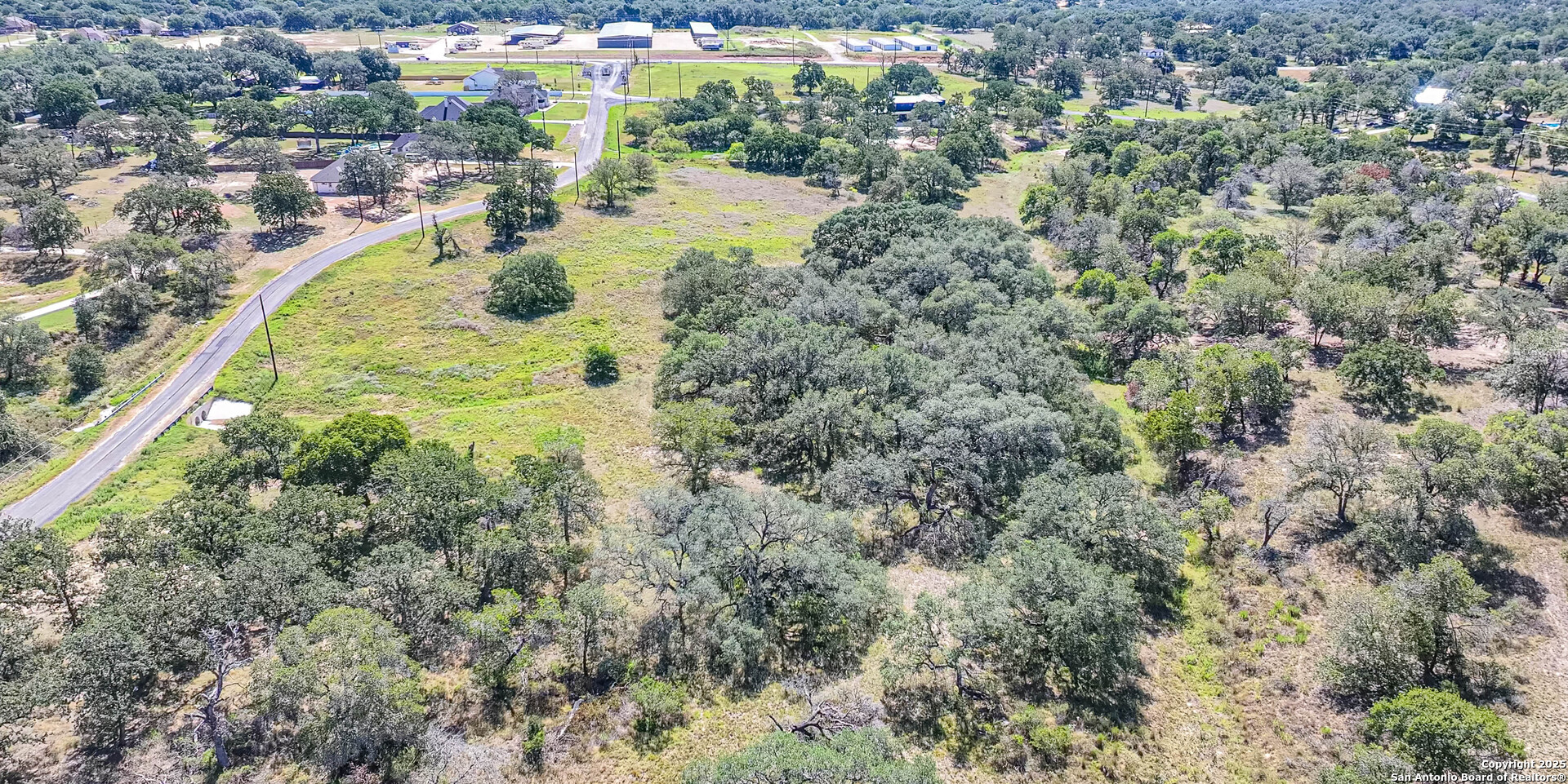100 Timber Heights La Vernia, TX 78121 - Photo 5 of 6 an aerial view of residential houses with outdoor space and trees