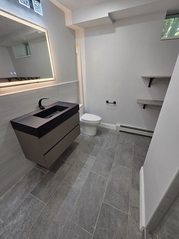 137 Centre Street, Unit B Boston, MA 02119 - Photo 5 of 10 a living room with a couch