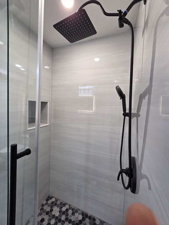 137 Centre Street, Unit B Boston, MA 02119 - Photo 6 of 10 a bathroom with a shower