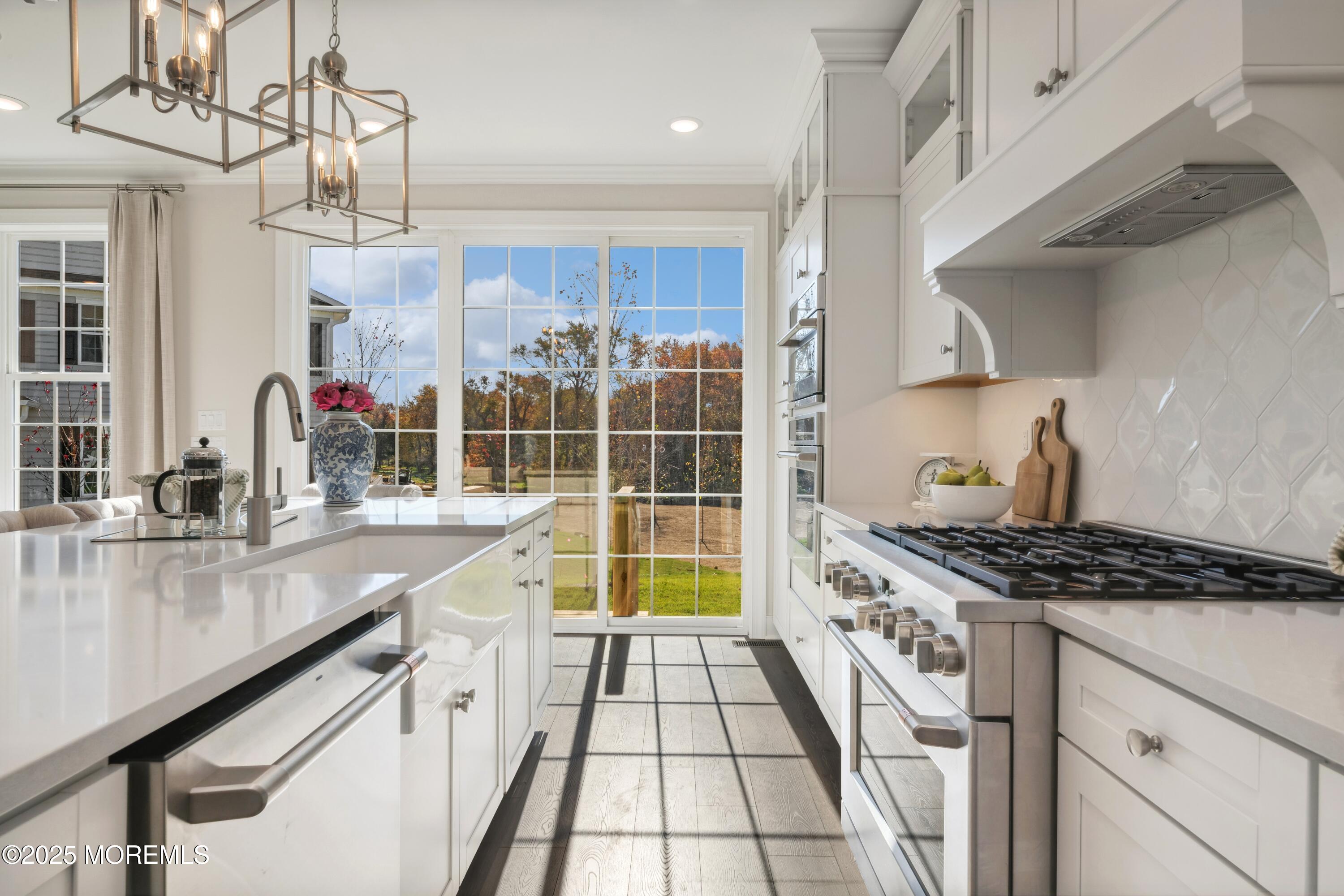 4061 Heron Drive Farmingdale, NJ 07727 - Photo 12 of 36 a kitchen with granite countertop a stove and a sink