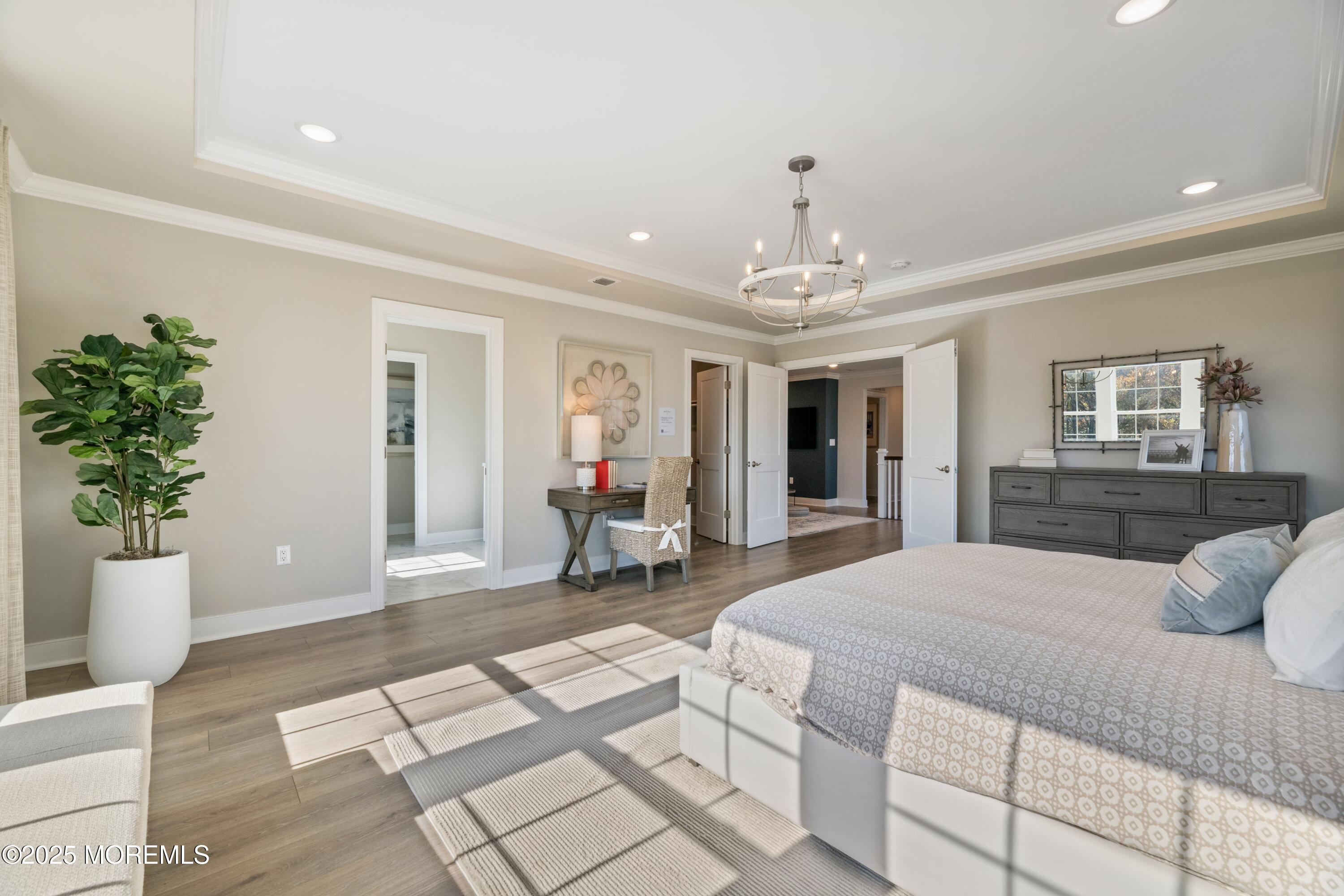 4061 Heron Drive Farmingdale, NJ 07727 - Photo 23 of 36 a bedroom with a large bed and potted plant