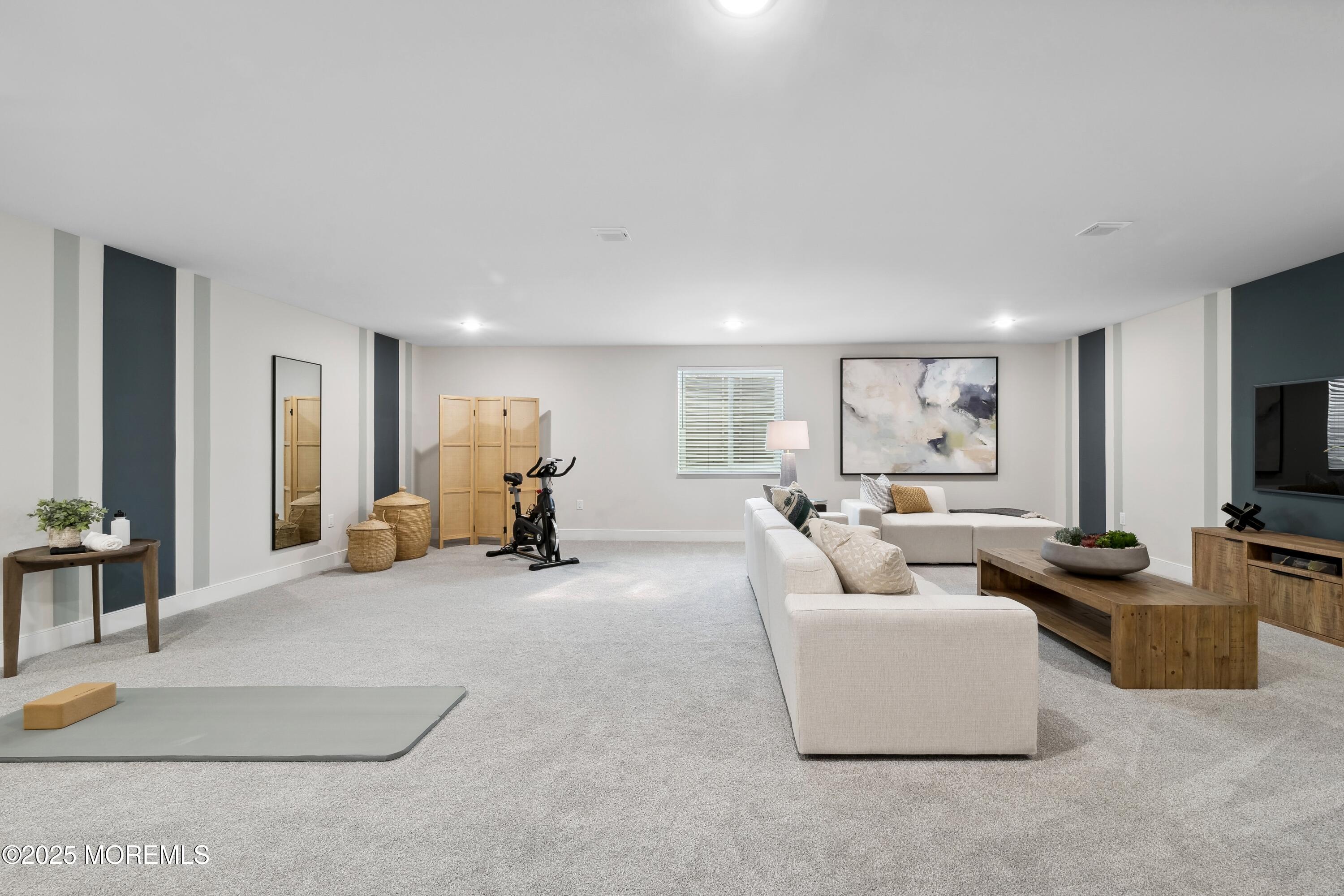 4061 Heron Drive Farmingdale, NJ 07727 - Photo 30 of 36 a living room with furniture and a flat screen tv