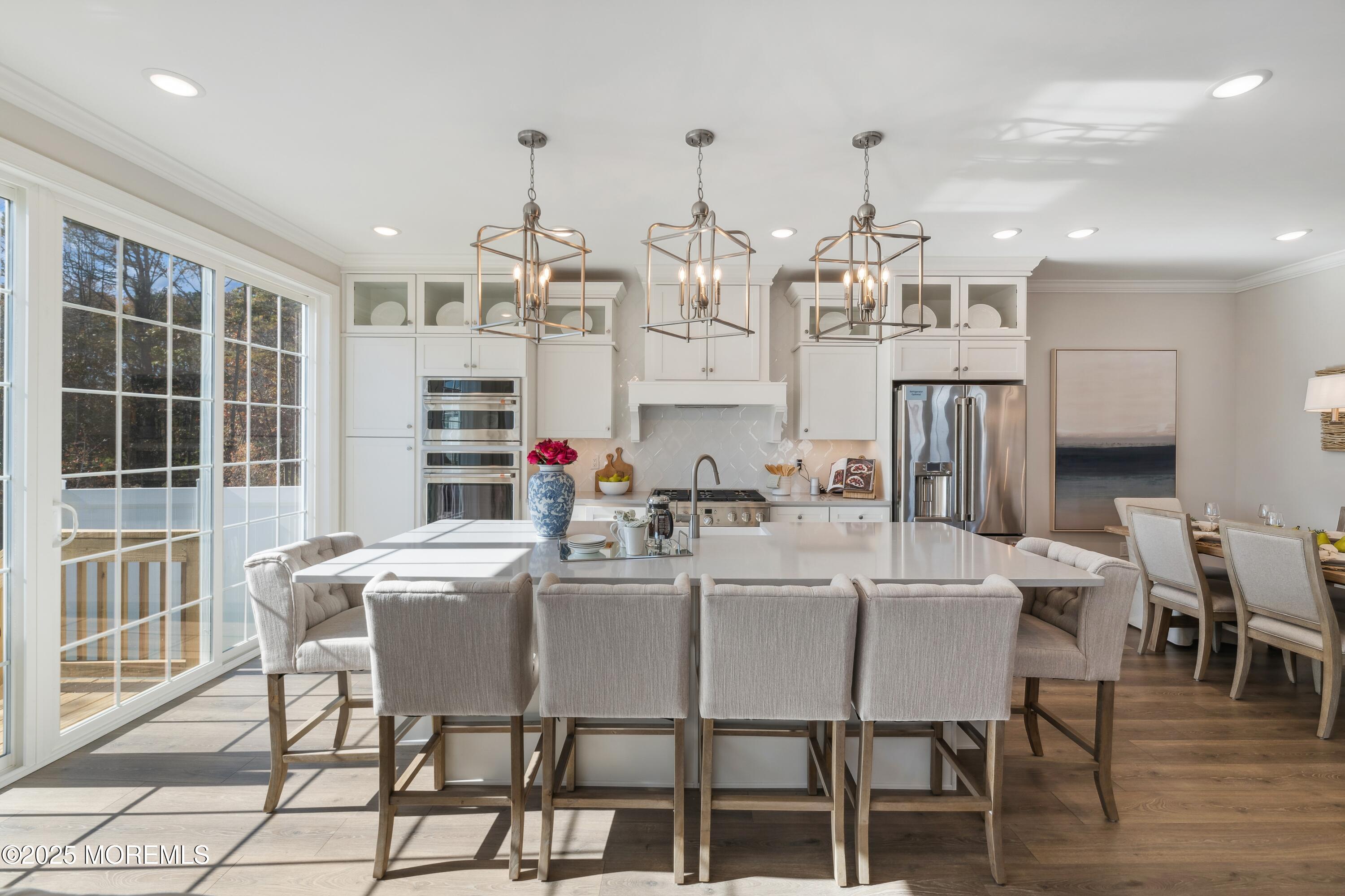 4061 Heron Drive Farmingdale, NJ 07727 - Photo 10 of 36 a view of a dining room with furniture and wooden floor