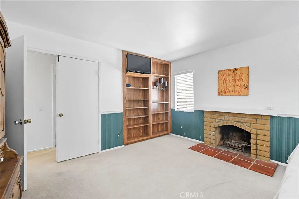 21902 Raintree Lane Lake Forest, CA 92630 - Photo 21 of 46 a view of a livingroom with an empty space and a fireplace