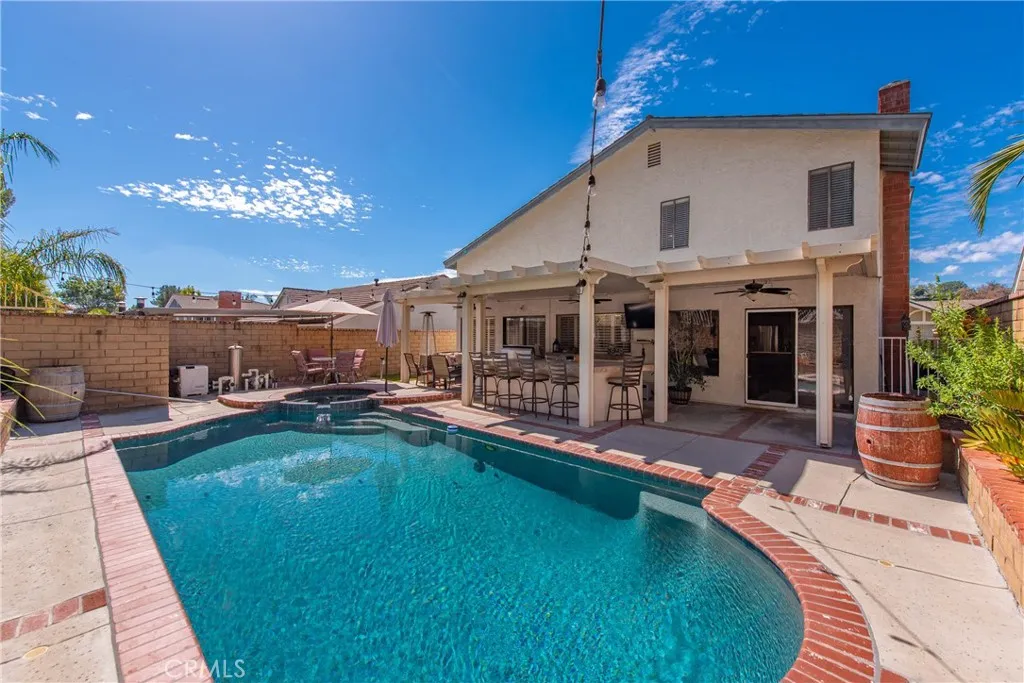 21902 Raintree Lane Lake Forest, CA 92630 - Photo 26 of 46 a view of a house with swimming pool and sitting area