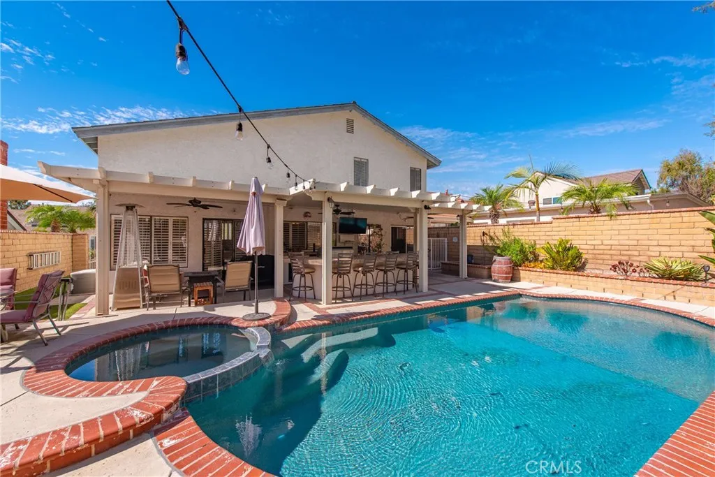 21902 Raintree Lane Lake Forest, CA 92630 - Photo 27 of 46 a view of a house with pool and chairs