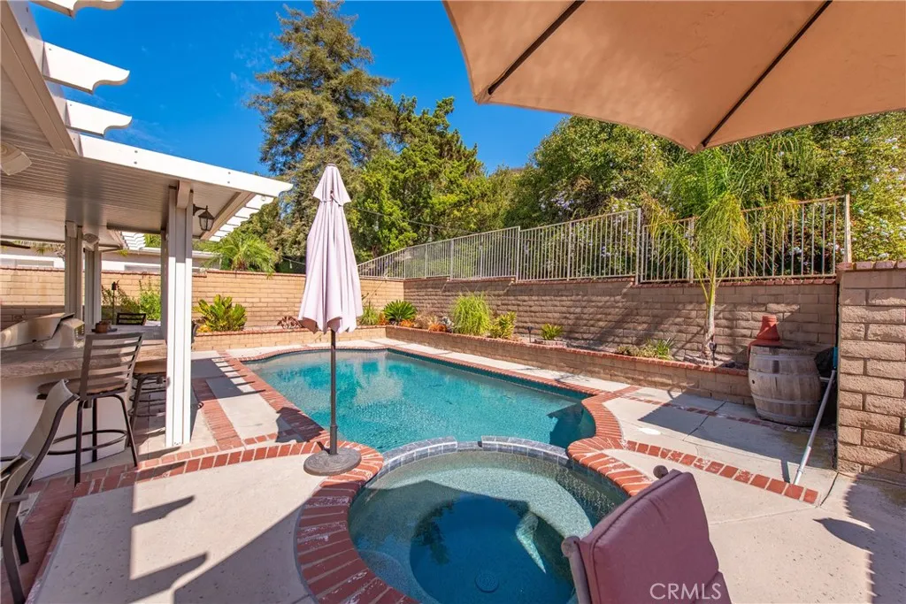 21902 Raintree Lane Lake Forest, CA 92630 - Photo 28 of 46 a view of a swimming pool with a patio
