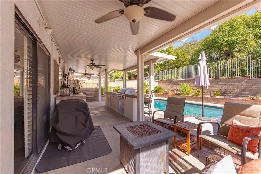 21902 Raintree Lane Lake Forest, CA 92630 - Photo 29 of 46 a view of a workspace with furniture and a yard