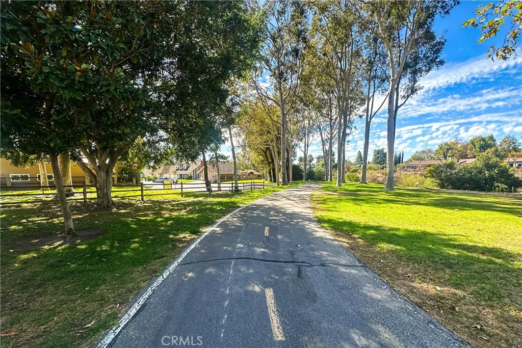 21902 Raintree Lane Lake Forest, CA 92630 - Photo 35 of 46 a view of a swimming pool with an outdoor space and seating area