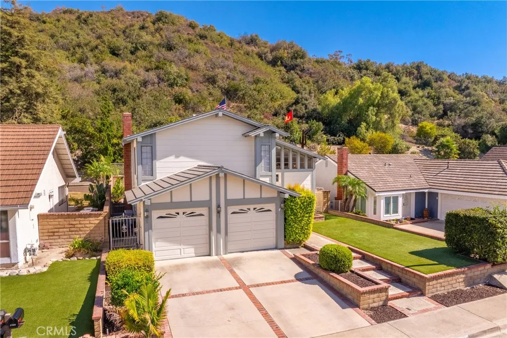 21902 Raintree Lane Lake Forest, CA 92630 - Photo 38 of 46 a view of a house with a big yard plants and large tree