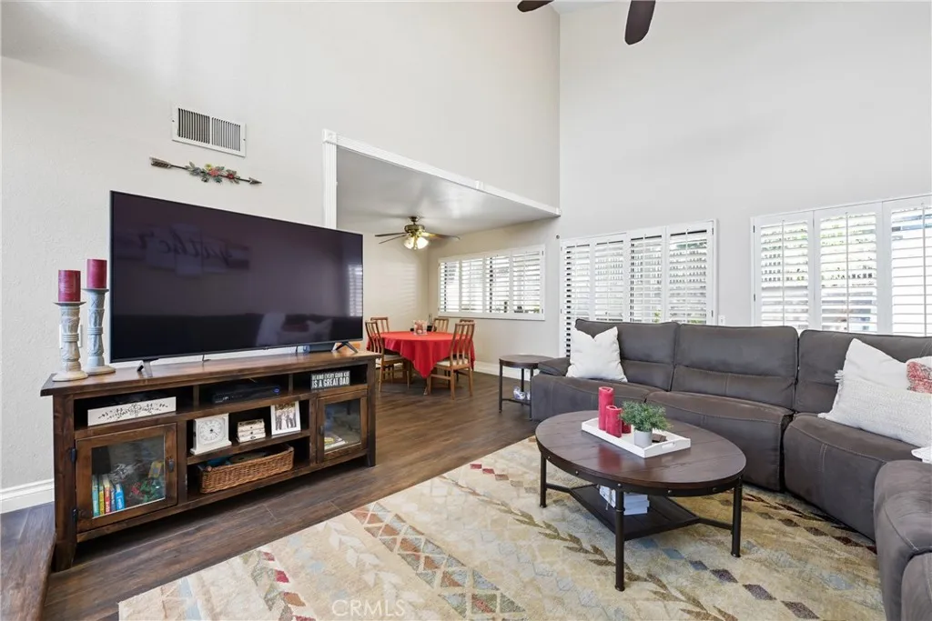 21902 Raintree Lane Lake Forest, CA 92630 - Photo 4 of 46 a living room with furniture and a flat screen tv