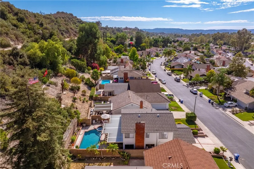 21902 Raintree Lane Lake Forest, CA 92630 - Photo 41 of 46 an aerial view of multiple houses with a street