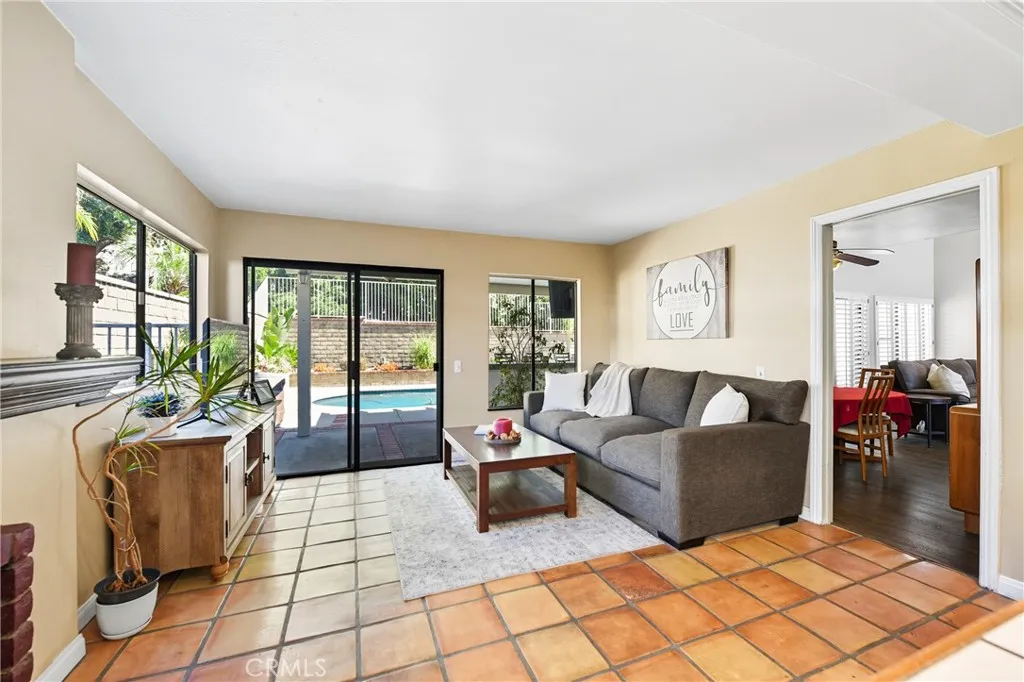 21902 Raintree Lane Lake Forest, CA 92630 - Photo 9 of 46 a living room with furniture and a large window