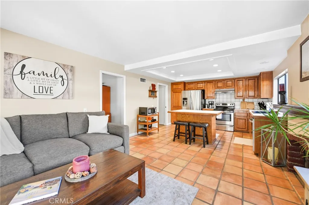 21902 Raintree Lane Lake Forest, CA 92630 - Photo 10 of 46 a living room with furniture and a table