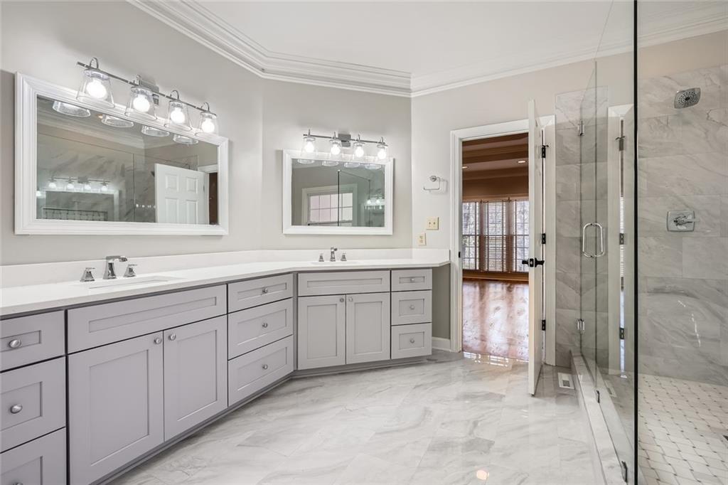 3330 Valley Vista Road Southeast Smyrna, GA 30080 - Photo 15 of 40 a spacious bathroom with double sink and a mirror