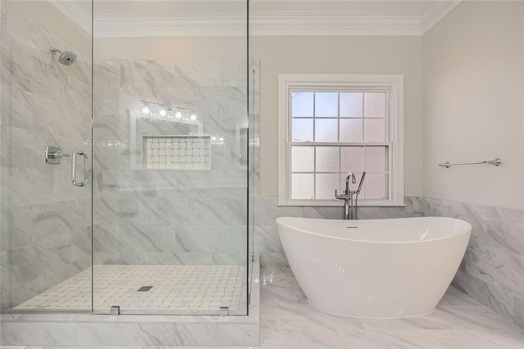 3330 Valley Vista Road Southeast Smyrna, GA 30080 - Photo 16 of 40 a white bath tub sitting next to a shower
