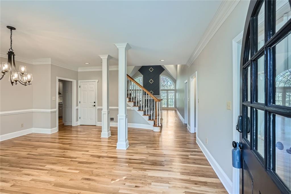 3330 Valley Vista Road Southeast Smyrna, GA 30080 - Photo 2 of 40 a view of a hallway with wooden floor and staircase