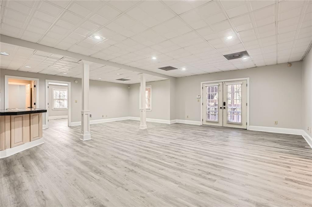 3330 Valley Vista Road Southeast Smyrna, GA 30080 - Photo 27 of 40 a view of an empty room with wooden floor and a window