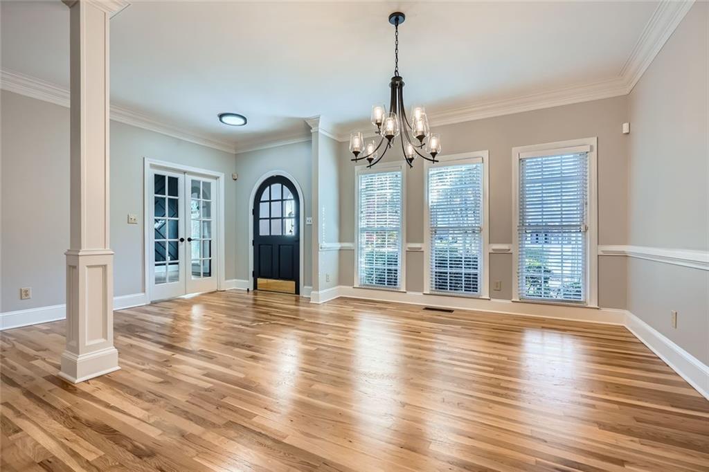 3330 Valley Vista Road Southeast Smyrna, GA 30080 - Photo 3 of 40 a view of an empty room with wooden floor and a window