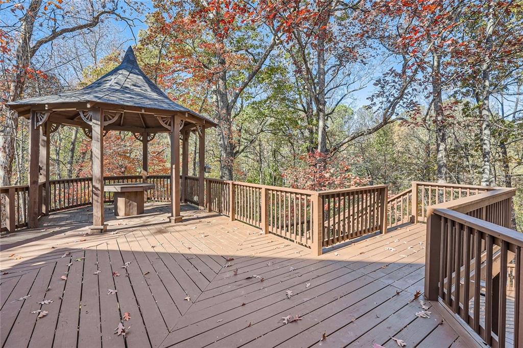 3330 Valley Vista Road Southeast Smyrna, GA 30080 - Photo 33 of 40 a view of a roof deck with wooden floor and fence next to a yard