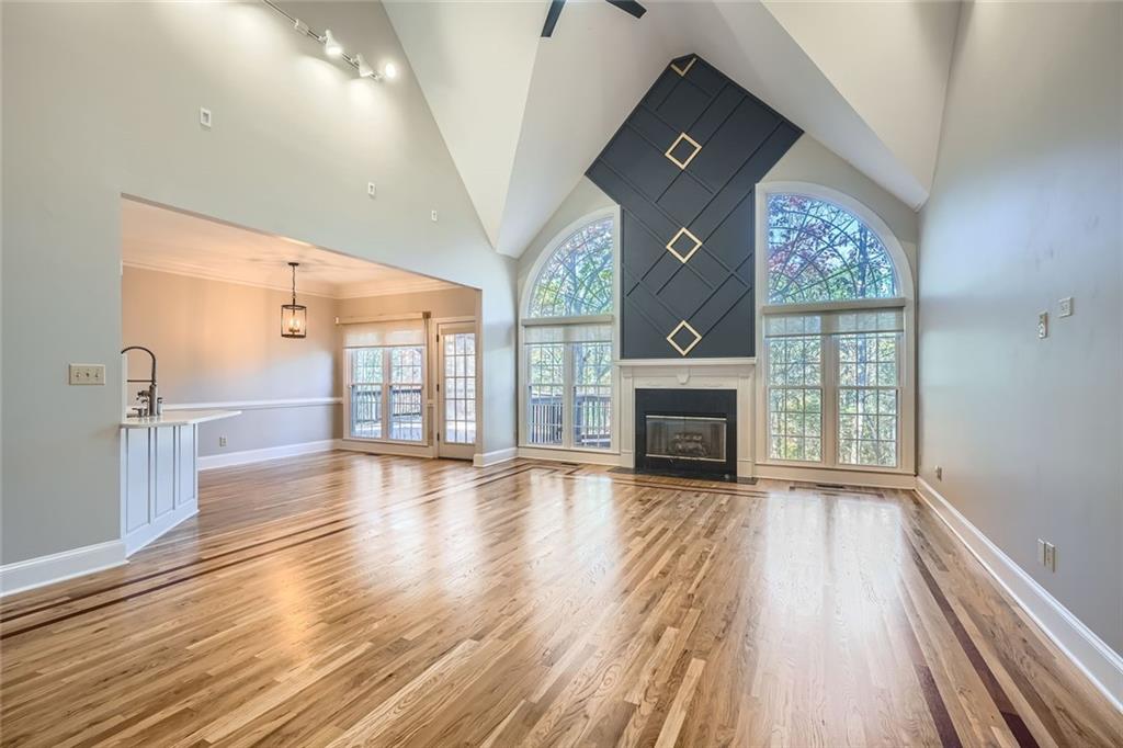 3330 Valley Vista Road Southeast Smyrna, GA 30080 - Photo 5 of 40 a view of empty room with wooden floor and fireplace