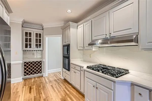 a kitchen with cabinets and appliances