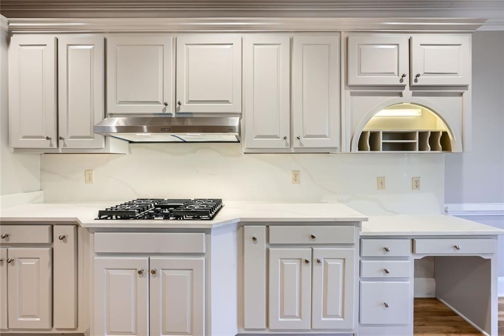 3330 Valley Vista Road Southeast Smyrna, GA 30080 - Photo 10 of 40 a kitchen with white cabinets and appliances