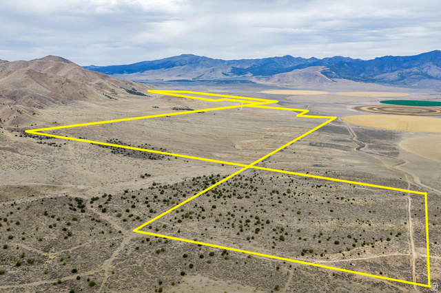 12800 South Crooked Cyn Road South Elberta, UT 84626 - Photo 10 of 48 Expansive desert landscape with mountainous terrain and visible distant agricultural fields