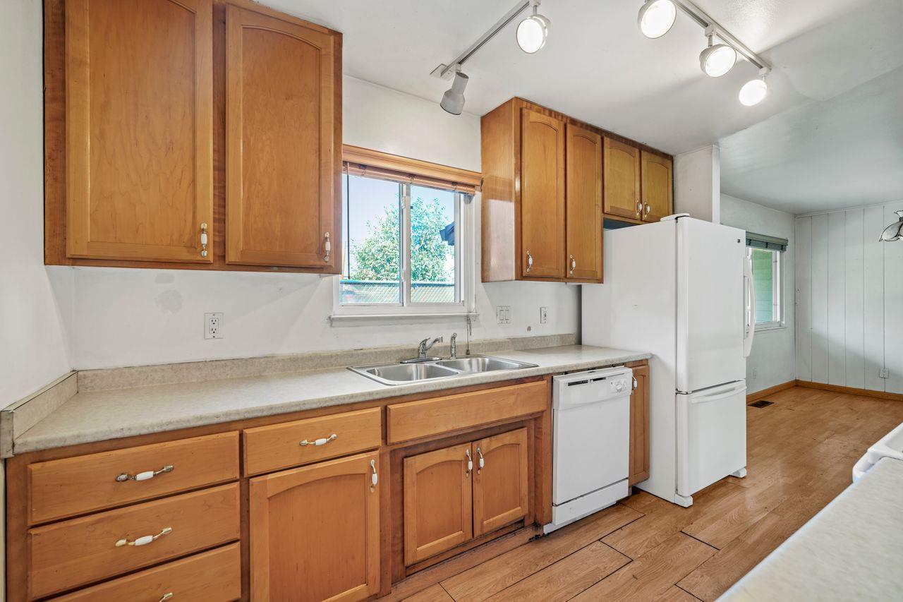 3331 Taylor Road Loomis, CA 95650 - Photo 11 of 97 a kitchen with a sink a refrigerator and window