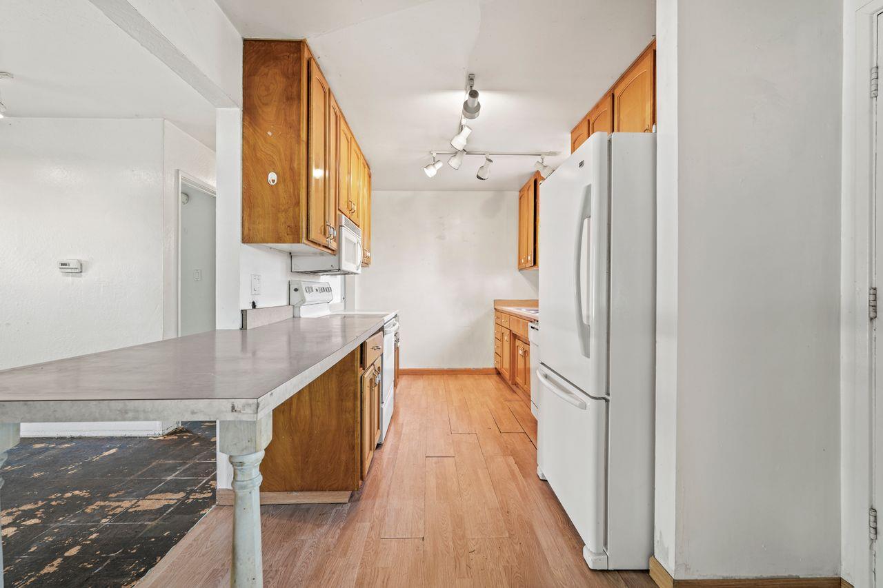 3331 Taylor Road Loomis, CA 95650 - Photo 13 of 97 a kitchen with granite countertop a sink a counter space and stainless steel appliances